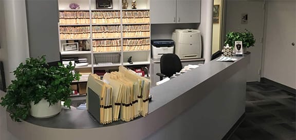 Checkout area for Marin Reconstructive Periodontics with lots of patient folders